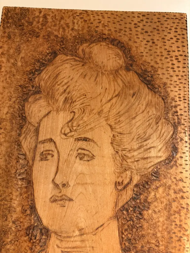 Vintage Pyrography plaque featuring a portrait of a Gibson Girl