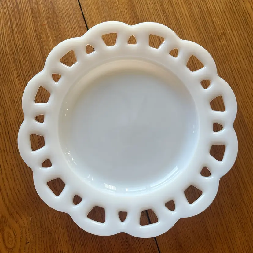 Vintage white milk glass plate with an open eyelet lace edge. 8.25”