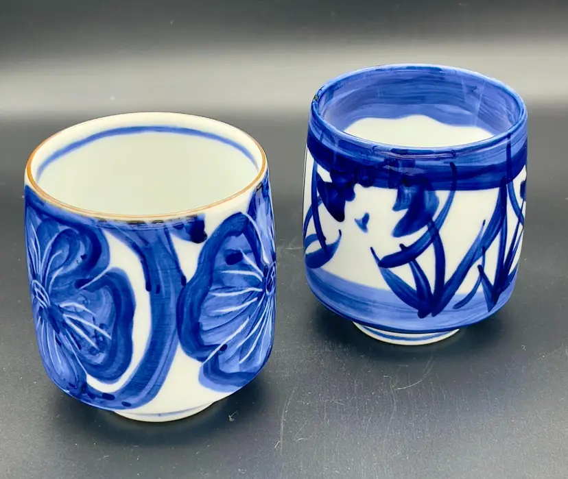 Vintage Kyoto Japan hand-painted with blue floral motifs tea cups.