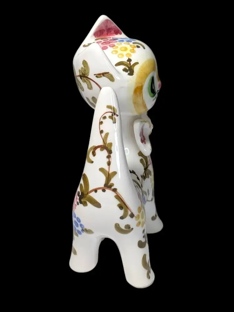 Charming Mid-Century Modern ceramic cat figurine featuring vibrant hand-painted florals and a cute bow tie.