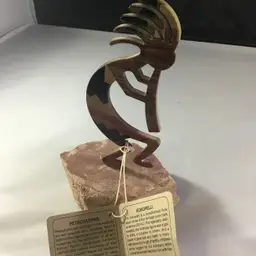 Kokopelli metal on stone base
