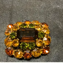 VTG Olivine And Amber Rhinestone Brooch Made In Austria. Measures 1.75” X1.5”