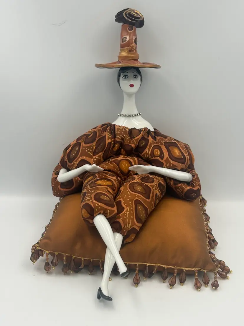 Pouppe By Isabelle Bean Filled Doll With porcelain Arms, Legs, Head Wearing Tall Hat Sitting On Beaded  Satin Cushion