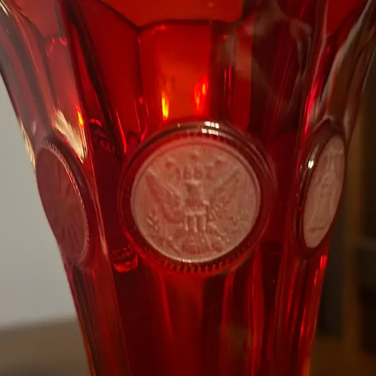 Fostoria Ruby Coin Glass bud vase with a flared rim and hexagonal base. 8”