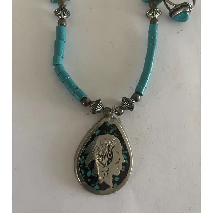 Turquoise colored necklace and Two rings