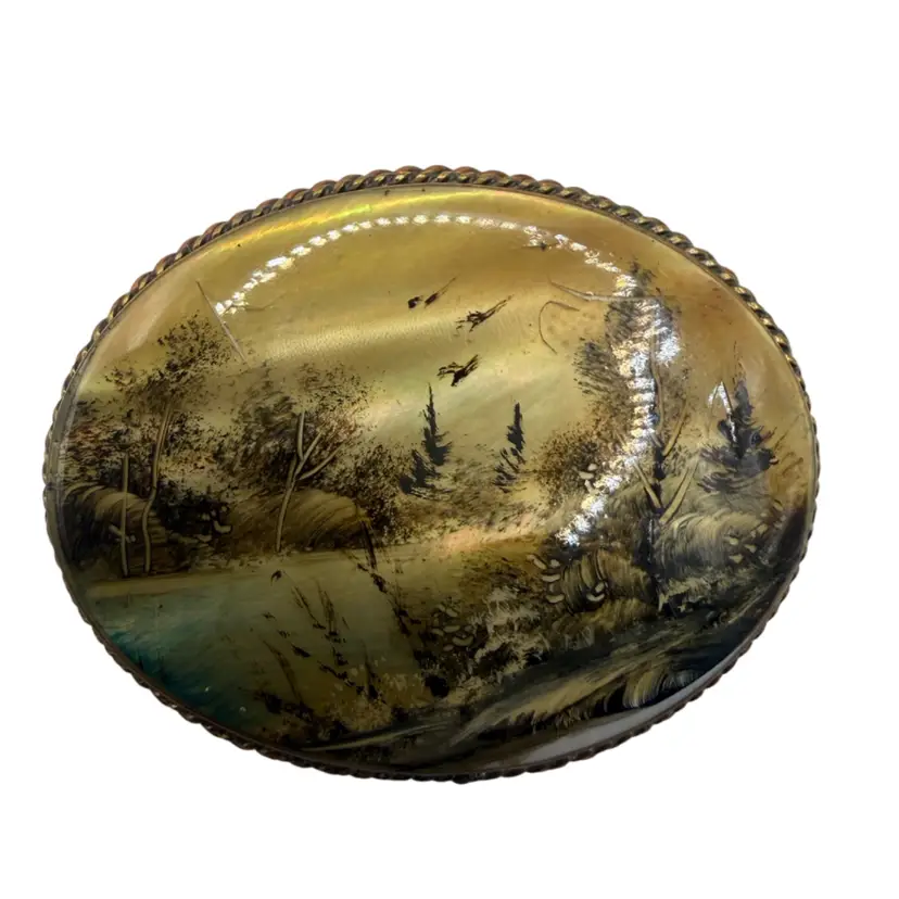 vintage Fedoskino-style Russian brooch featuring a hand-painted scenic oil painting on a mother of pearl base
