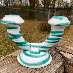 Gmundner Keramik, Dizzy Green, Double Candleholder. 6.25”l x 4.25”h. Stamped.
Made in Austria.