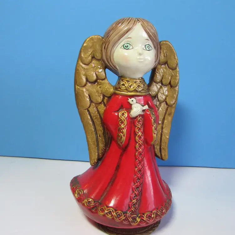 vintage composite angel holding a bird musical figure Christmas decor 9"