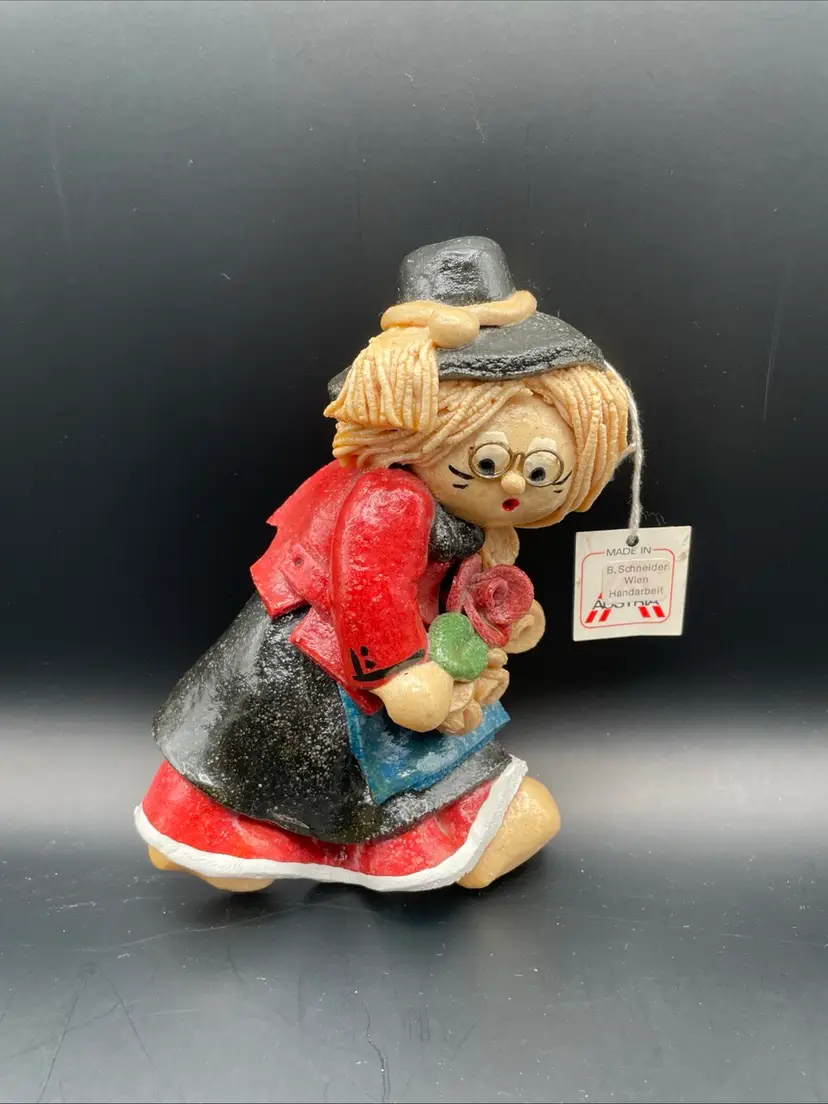 Busy Girl With Hat And Glasses Carrying Flowers Wall Hanging