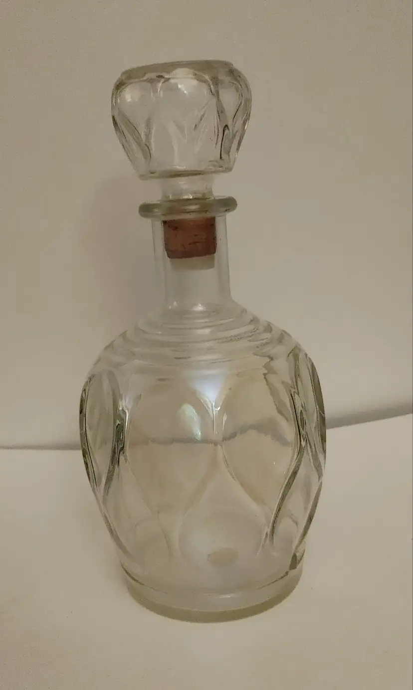 Decanter- MCM. Thumbprint or teardrop pattern. 9.5 inches high. No condition issues.