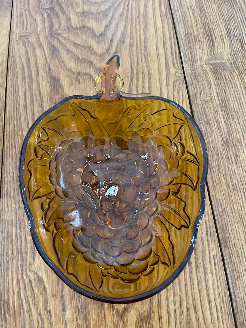 #01 Amber pressed glass grape cluster fruit bowl by Indiana Glass. Circa 1970S Bowl Is 10 “ By 9.5” 13 Inches From Stem To End.