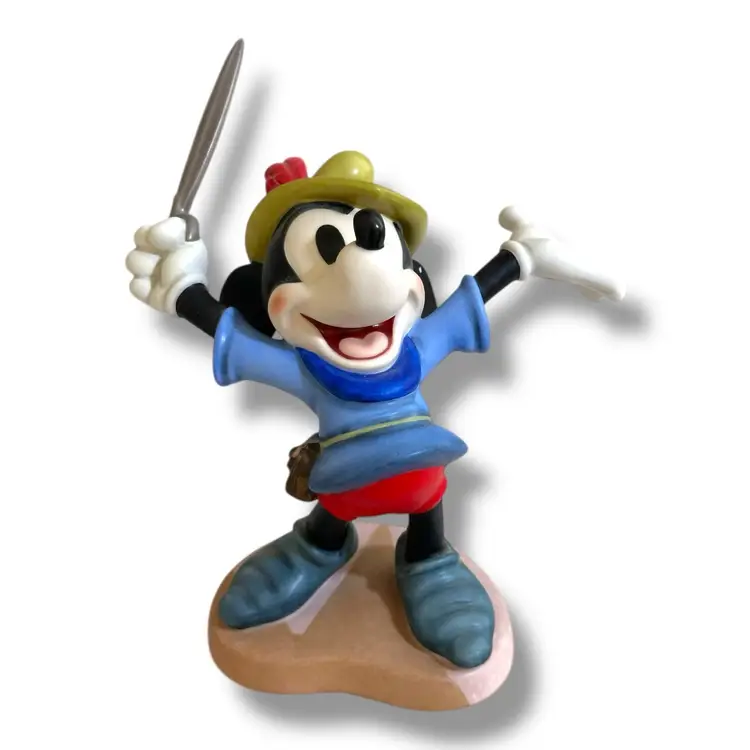 This product is a vintage 1993 Mickey Mouse figurine from the Walt Disney Collectors Society's (WDCC) Brave Little Tailor closed edition. Standing at 6 inches tall, this collectible piece was available to members only. It will be carefully wrapped, packaged, and shipped to you right away.