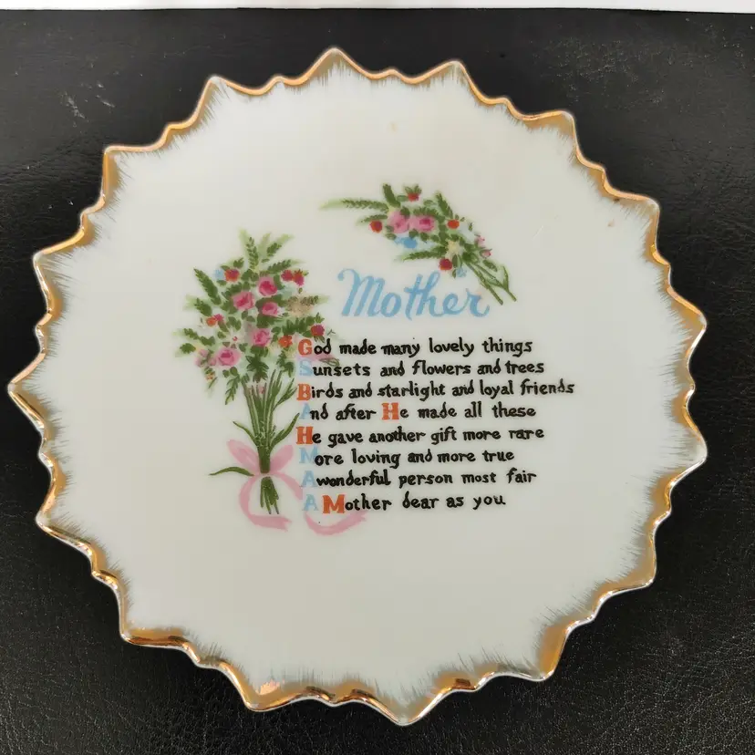 Mother Trinket Dish. Made in Japan. 5 inch diameter. Small chip on bottom rim.