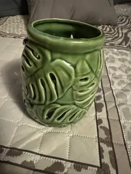 Ceramic tropical leaf design candle holder.