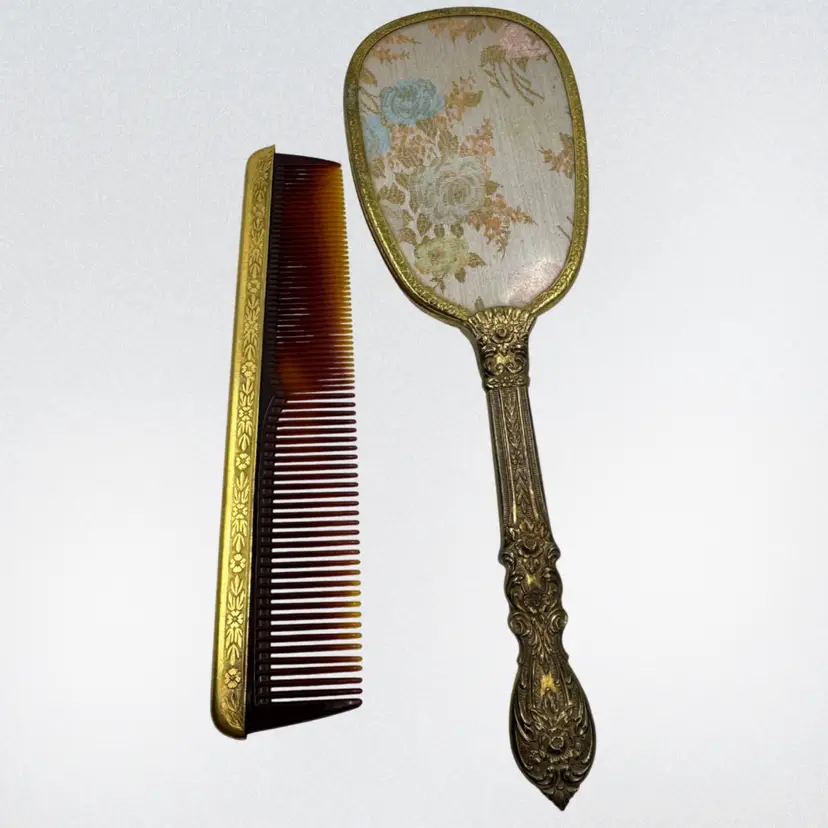 Vintage ornate hand mirror and decorative comb set. Silk Backed Mirror, Gold Tone Comb Spine Cover.