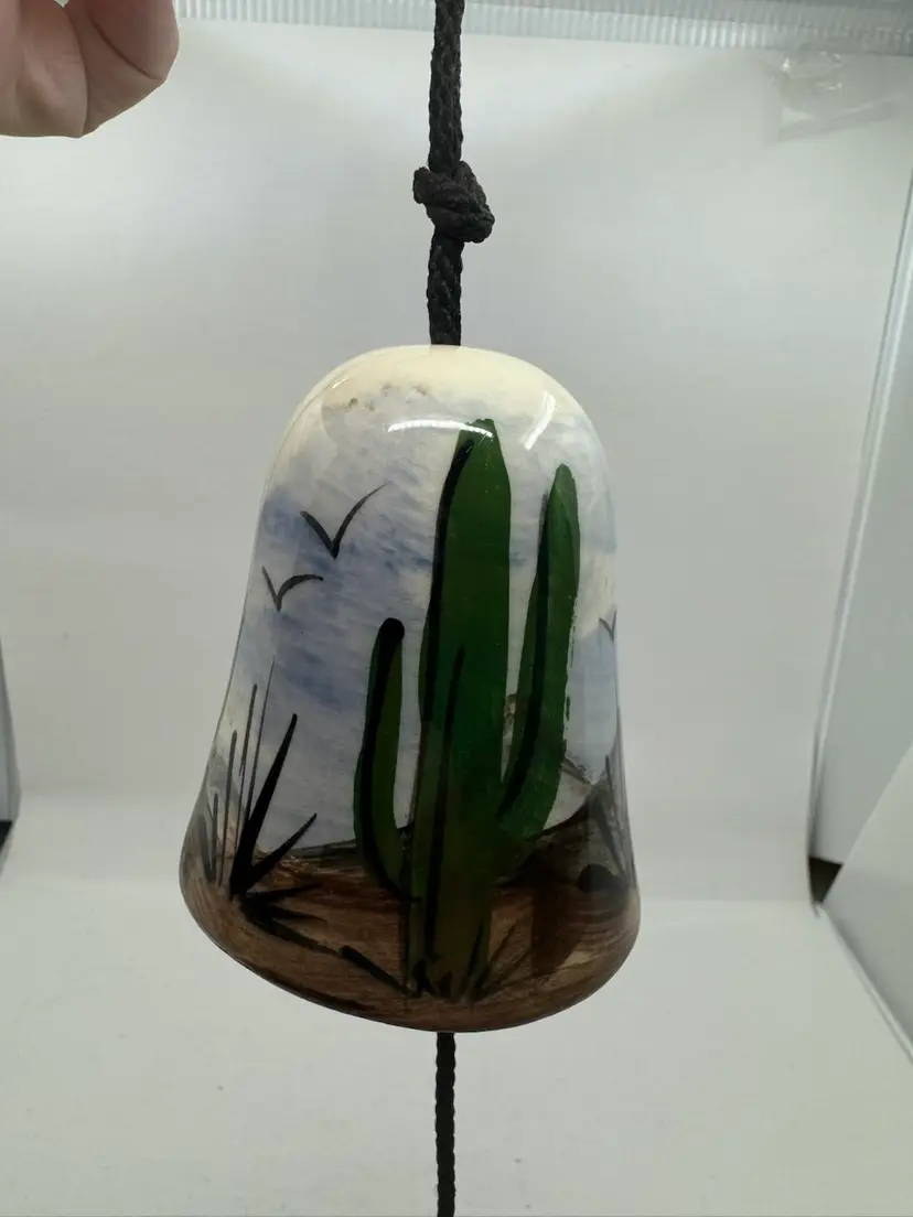 Hand-painted ceramic wind chime bell with a Southwestern desert scene