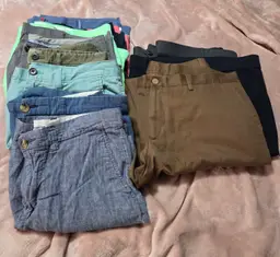 Reseller Lot of 11 Men's Pants. Contains 8 Shorts and 3 Long Pants. Various Brands and Sizes.