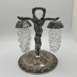 vintage set of salt and pepper shakers featuring a grape and leaf design. 1970’s