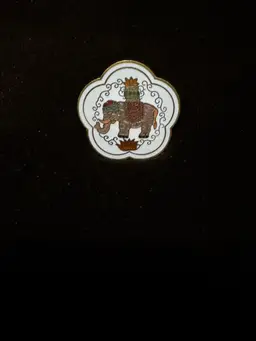 Vintage Scarf Clip featuring an enameled design of a king on a white elephant