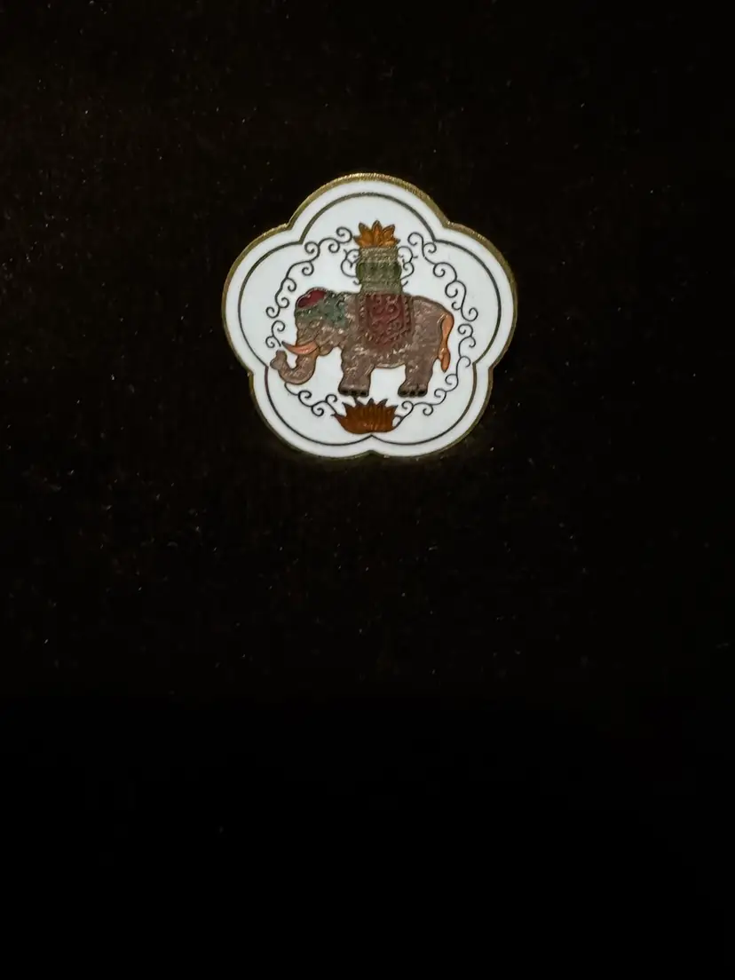 Vintage Scarf Clip featuring an enameled design of a king on a white elephant