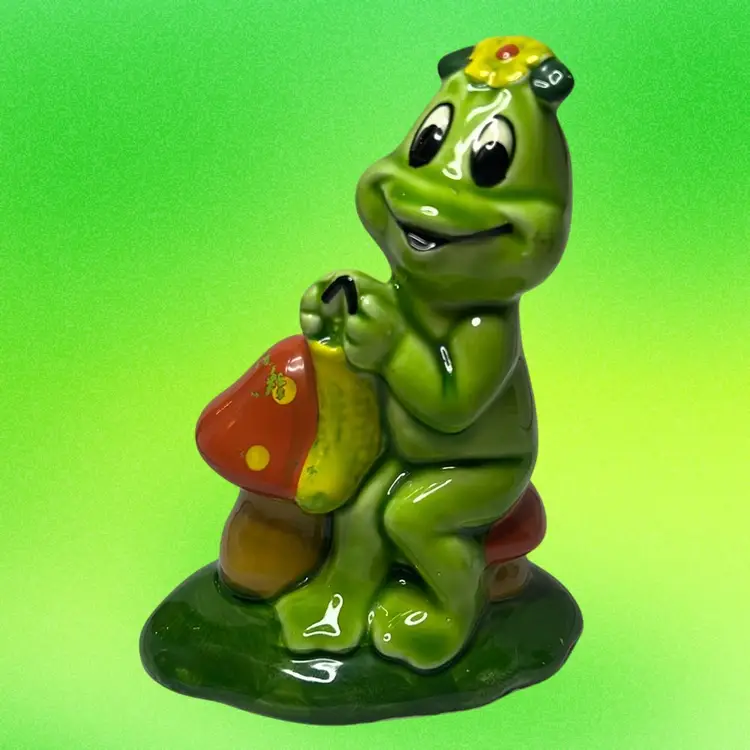 Vintage Lefton ceramic Frog Sitting On A Mushroom & Knitting.
Such A Colorful Figurine.
