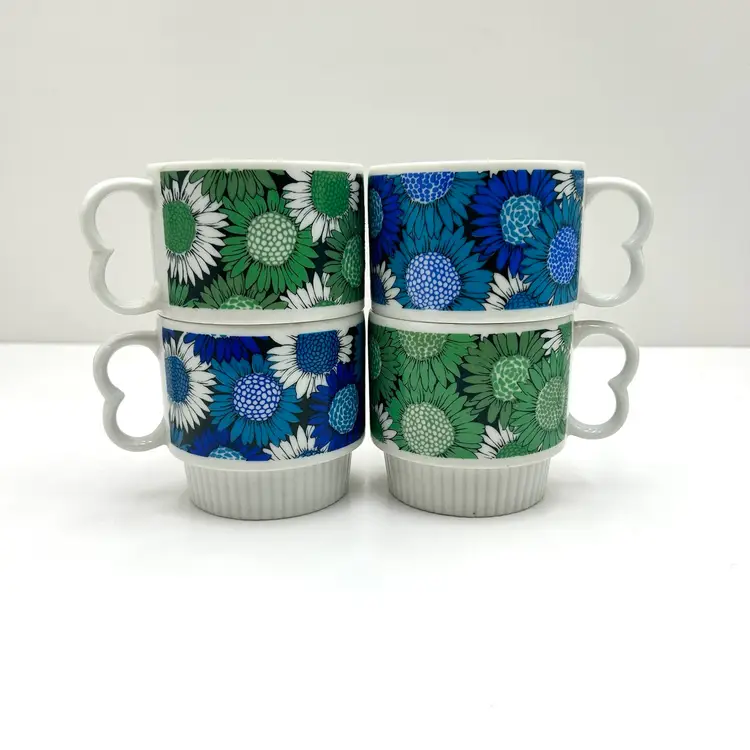 Retro Stacking Green And Blue Daisy Mugs With Hear Handles