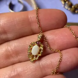 Milk, glass pendant with Ruby, Gold, tone and gold tone 16 inch chain