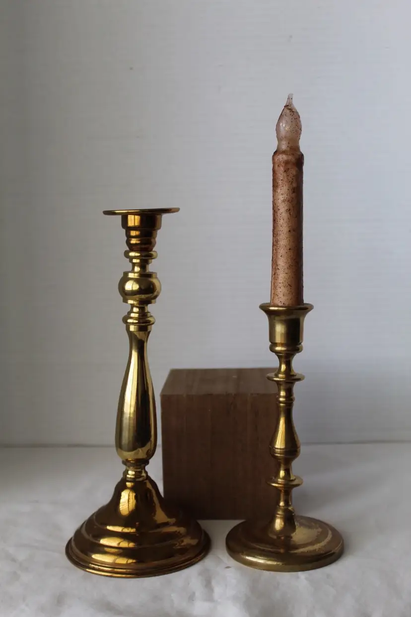 Pair of Mismatched Brass candlestick holders 9.5 And 7 Inches Respectively