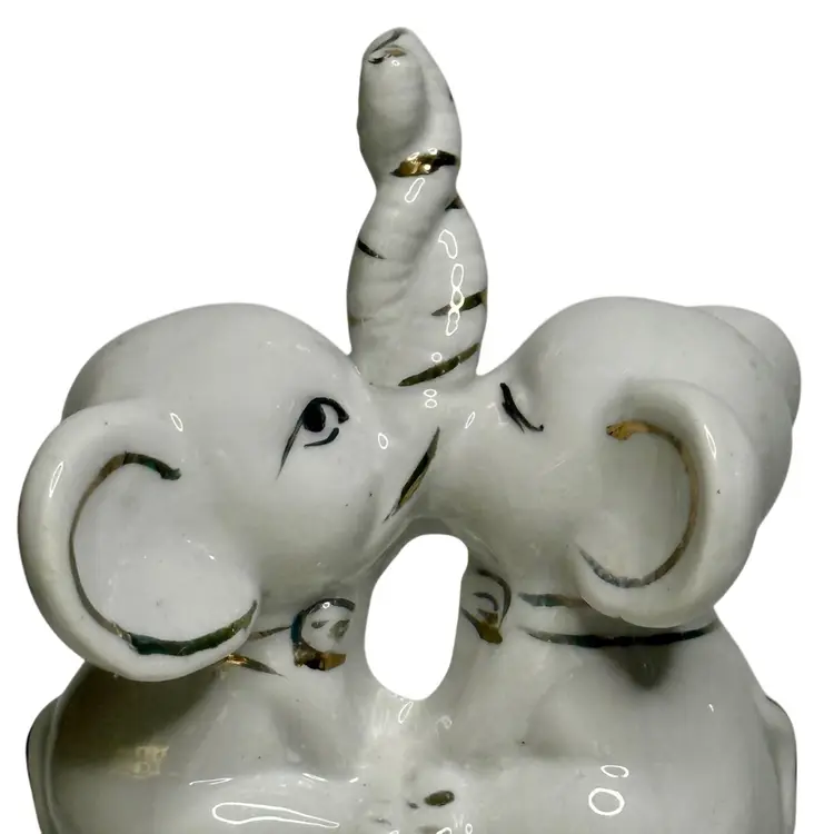 Vintage Elephant Figurine Ring Holder Two Twisted Trunks Up Ceramic Elephants White W/Gold  Accents
4-1/2” x 3-1/2” L x 2-1/4” W