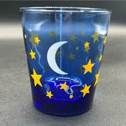 vintage Libbey cobalt blue tumbler glass featuring a celestial pattern