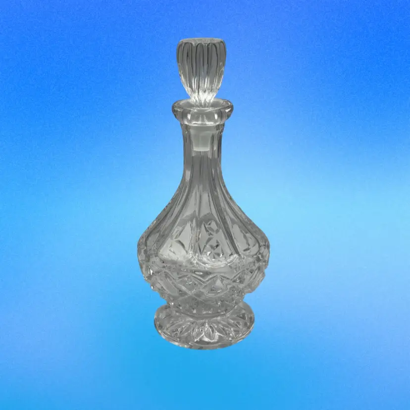 A25 A vintage-style cut crystal decanter or cruet with a stopper