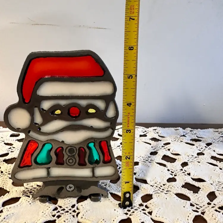 Vintage cast iron and stained glass Santa Claus votive candle holder.