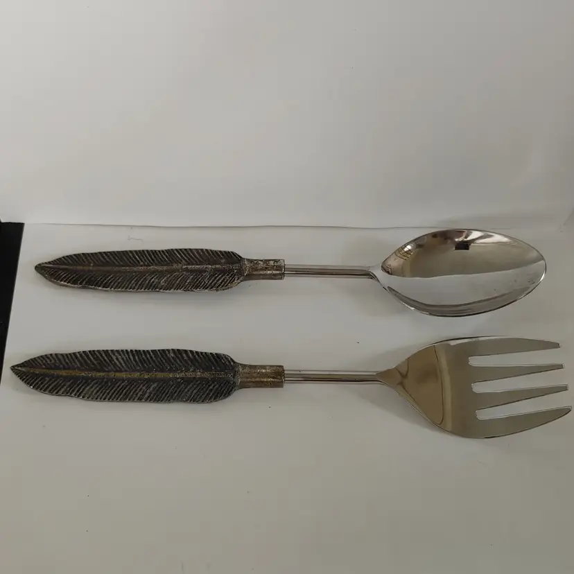 Serving utensils with feathers or quill base. 12 long.