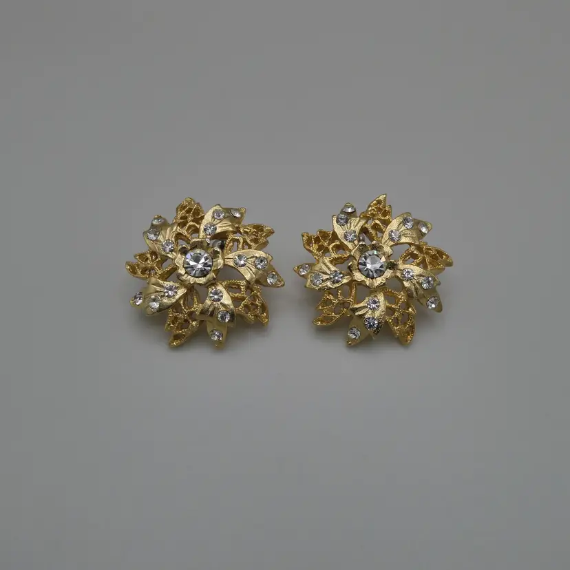 Vintage Designer Ornate Clear Rhinestone Pinwheel Filigree Post Earrings Domed Flower Gold Tone 1.25"