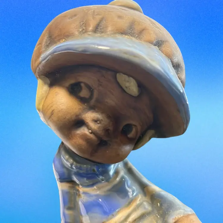 Pair of vintage ceramic figurines depicting a boy and a girl on toadstools/ Mushrooms. Signed. 5.5”tall