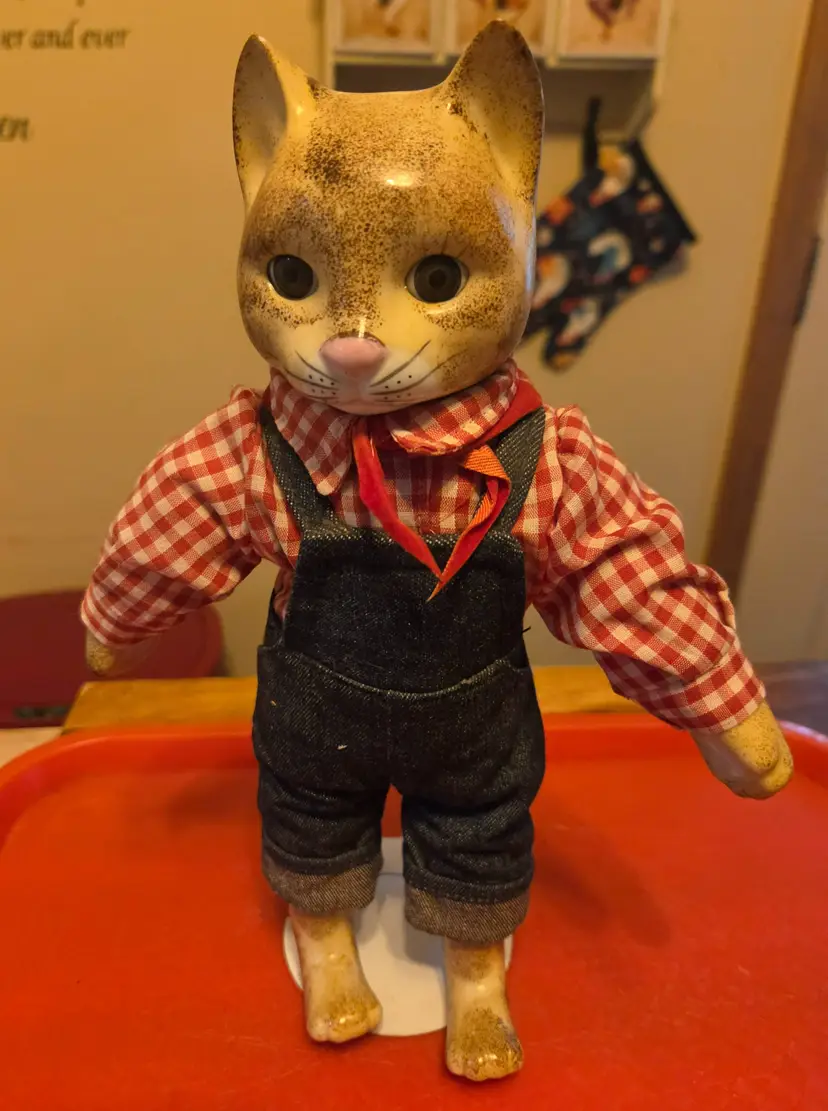 vintage porcelain country cat figurine in plaid shirt and jeans comes on display stand