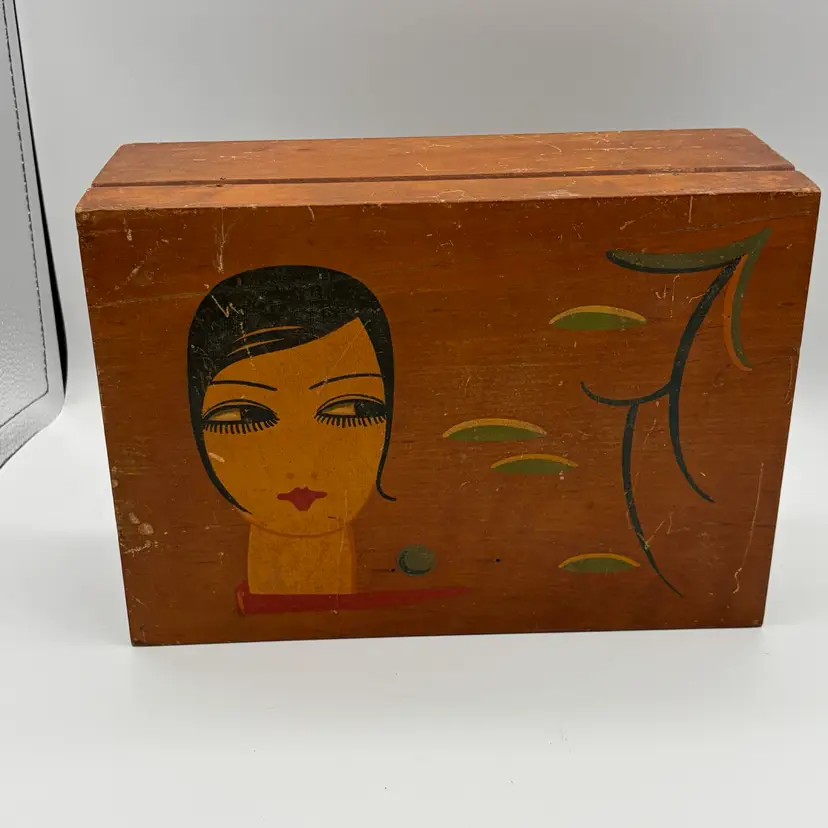 Vintage wooden box fArt Deco-style painted portrait of a woman with distinct 1920s-era styling