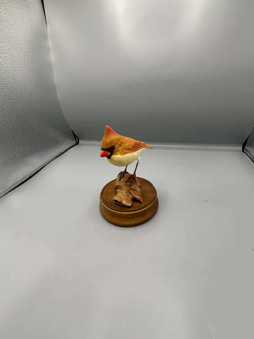 Female Cardinal bird on wood figure