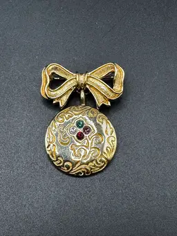 69 - Avon Bow Dangle Rhinestone Engraved Dear Brooch