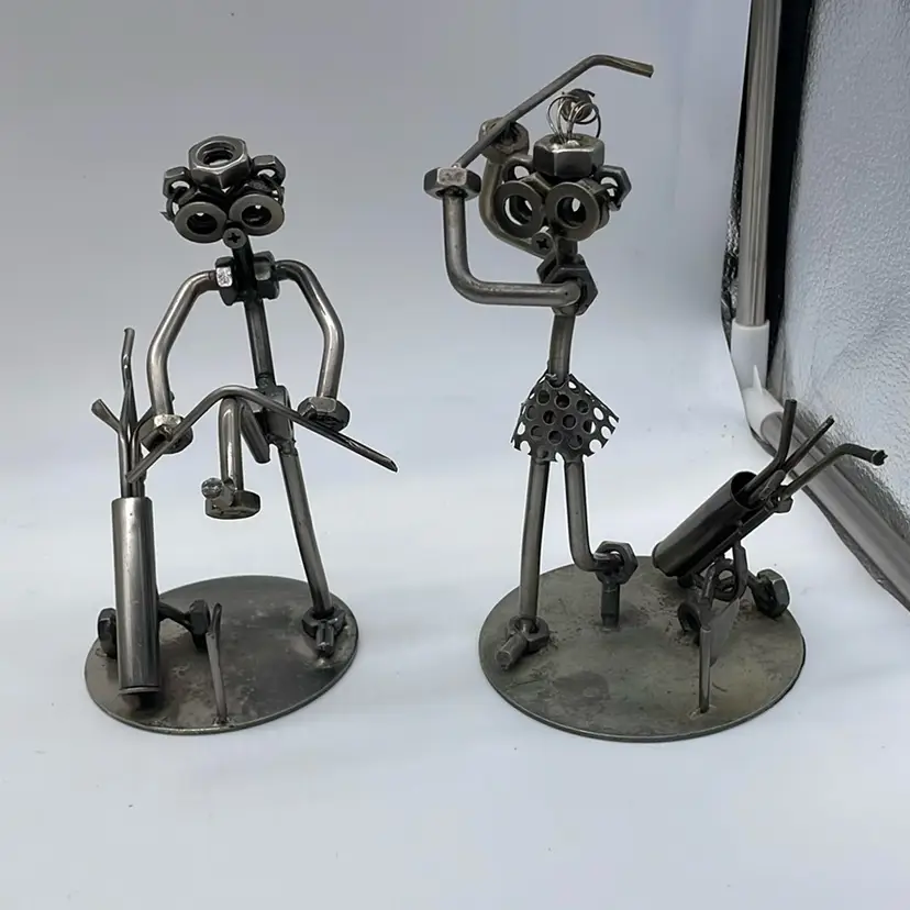 Golf nuts and bolts man and woman metal figurines