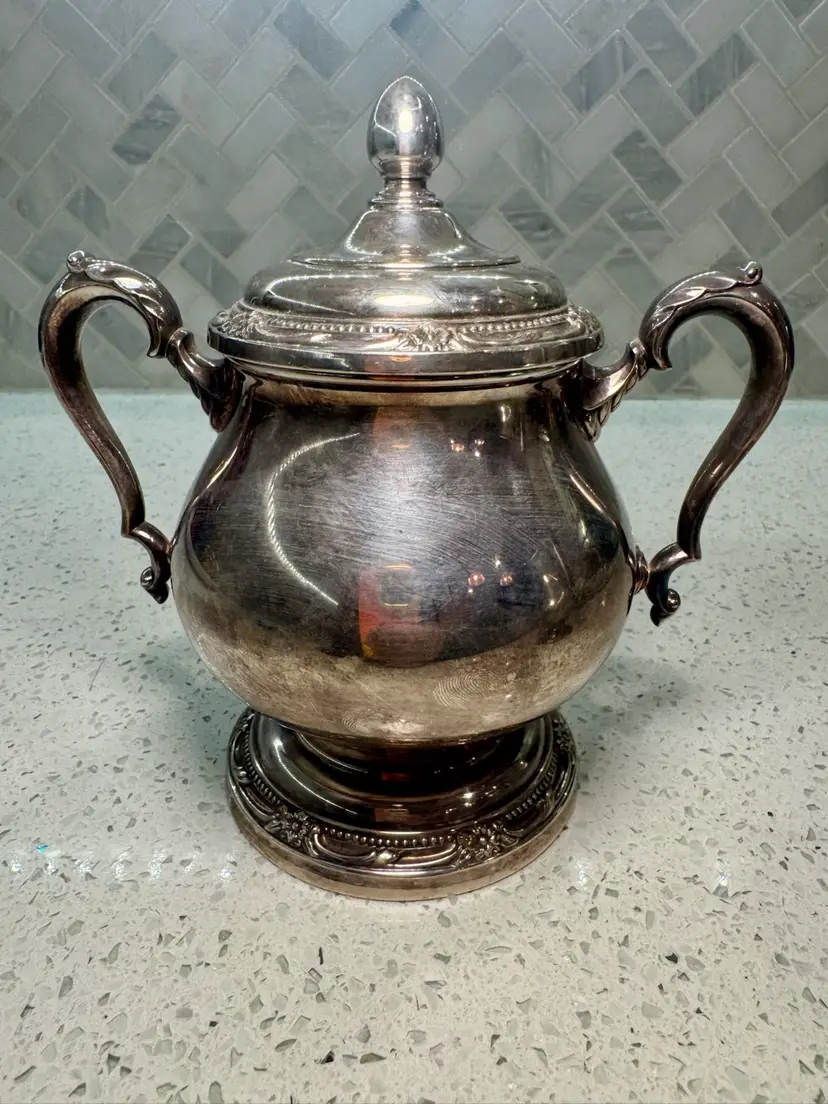 Vintage 6” tall 7” wide silver-plated sugar bowl and lid in Remembrance pattern, made by 1847 Rogers Bros.