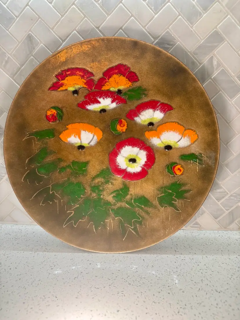 Vintage 14” floral enameled copper plate featuring a poppy design, signed by artist M. Ratcliff