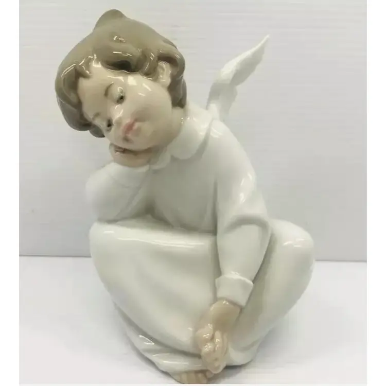 Lladro 1970s Glazed Porcelain " Dreaming Angel" figurine . Retired