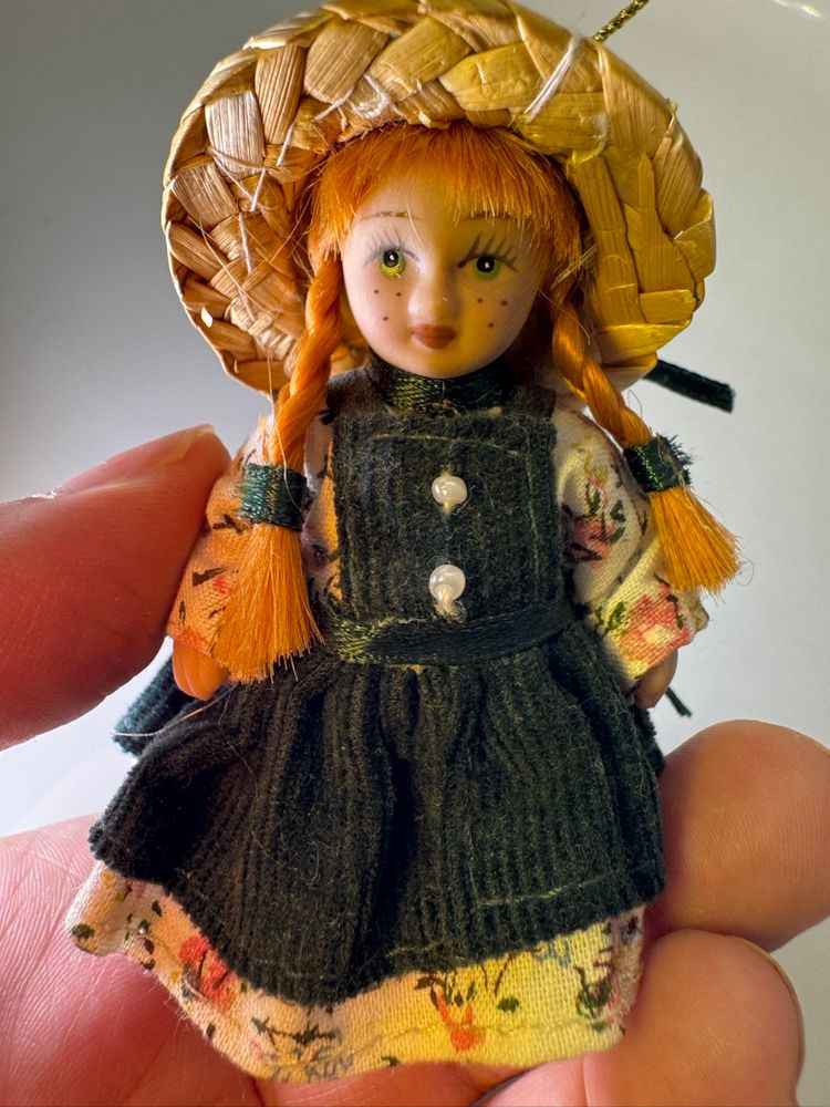 Vintage porcelain doll of Anne of Green Gables.