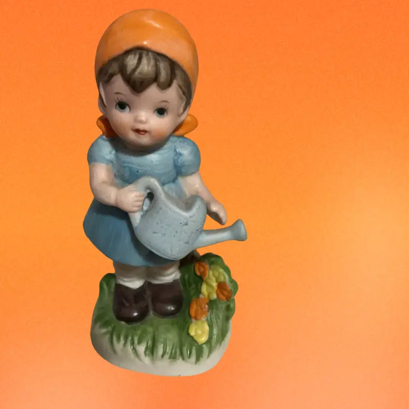 Vintage Lefton China Figurine. Titled “ Little Flower Gardening Girl “ Model # 01592 . Hand painted Ceramic. Very highly Collectable Figurine.