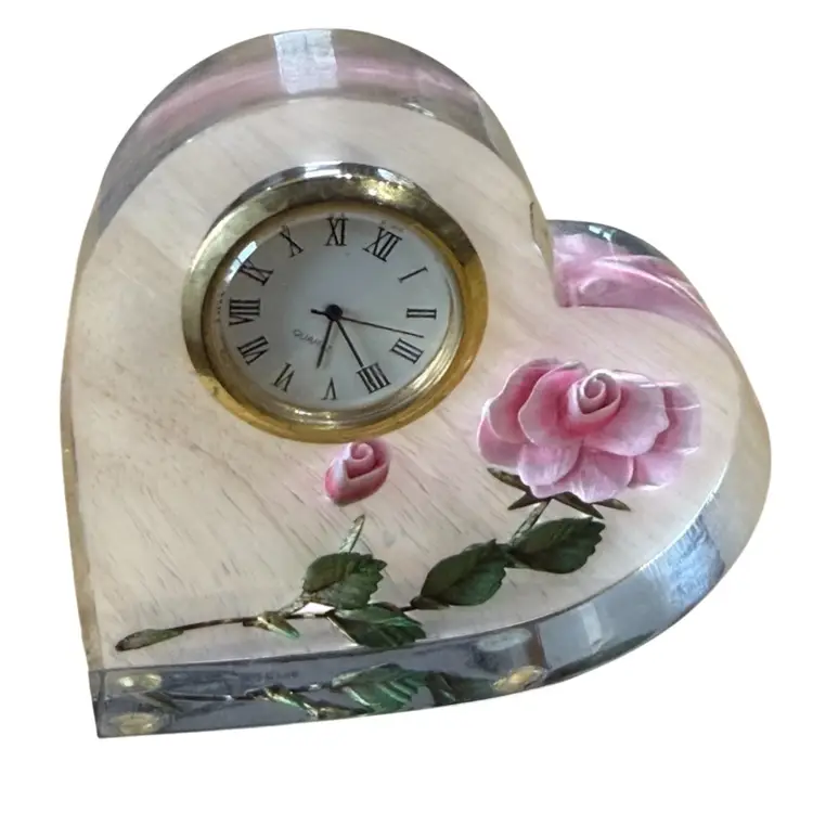 Bircraft heart-shaped clock features a 3D red rose embedded in clear acrylic or Lucite