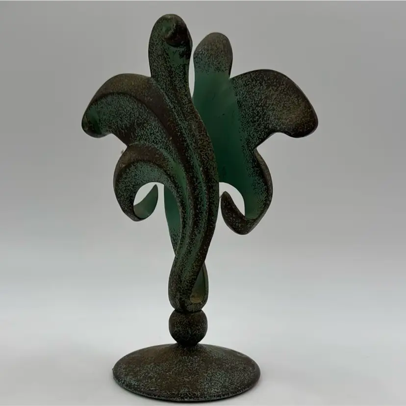 Art deco metal sculpture has lots of patina