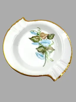 Elegant S-shaped Bone China Ashtray. Hand-Painted Morning Glory Florals. Artist Signed on Bottom “Mrs. Pearl L. Matthews Dec. 1962.” 22-24K Gold Trim on Rim.