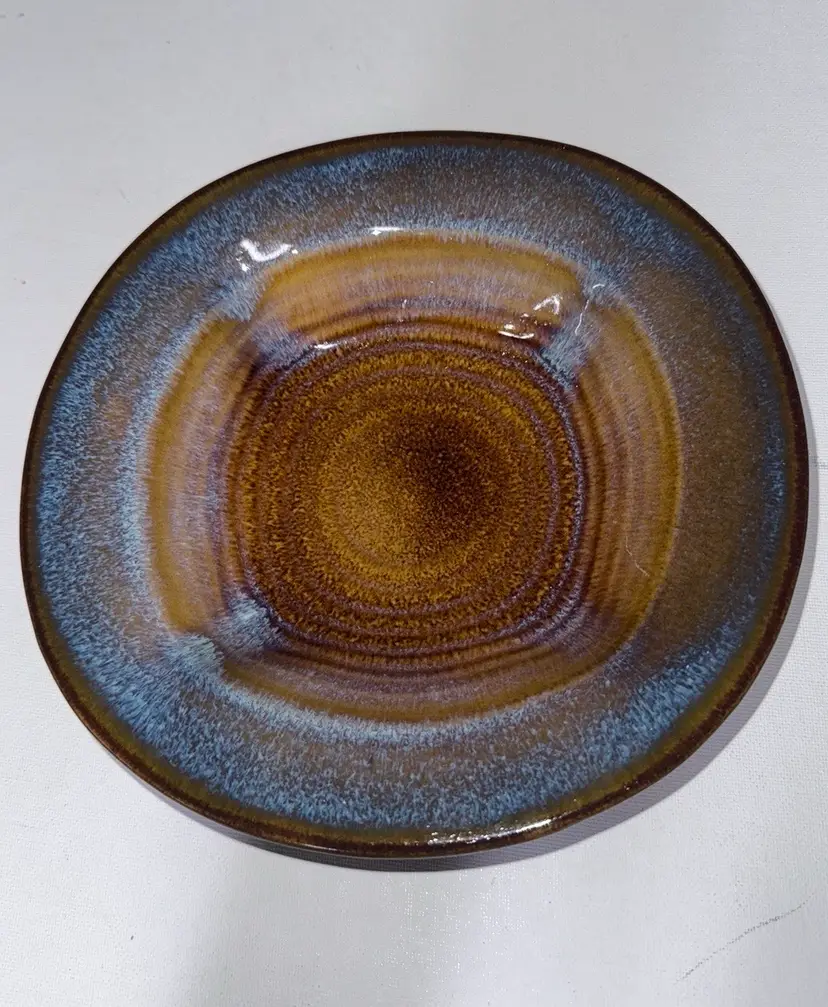 Bill Campbell pottery swirl square base bowl
brown and blue
8 1/2” diameter 1 7/8” high