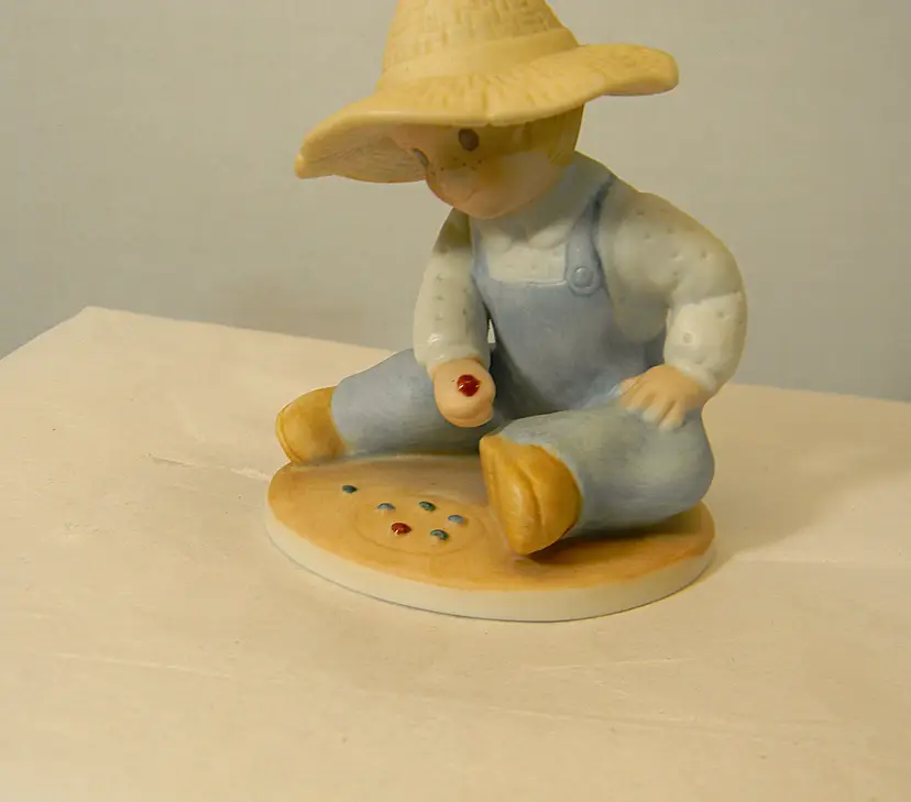 Circle of Friends Collection by Masterpiece Boy playing with marbles